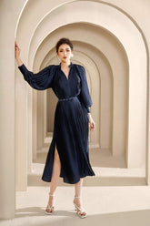 Pleated silk midi dress with belted waist and voluminous long sleeves
